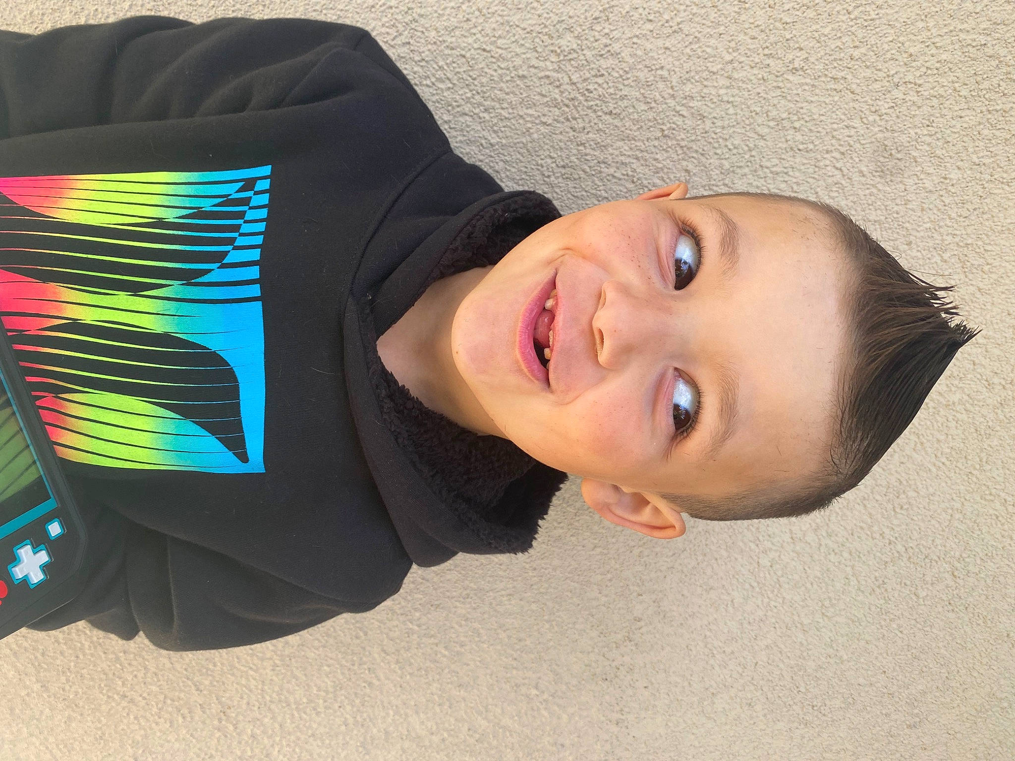 Tony is registered to the contest to win money with this photo: audio_equipment, child, cool, electric_blue, eyewear, fashion_accessory, fun, happy, headgear, joy, laugh, pattern, person, personal_protective_equipment, portrait_photography, sleeve, smile, t_shirt, toddler, tree