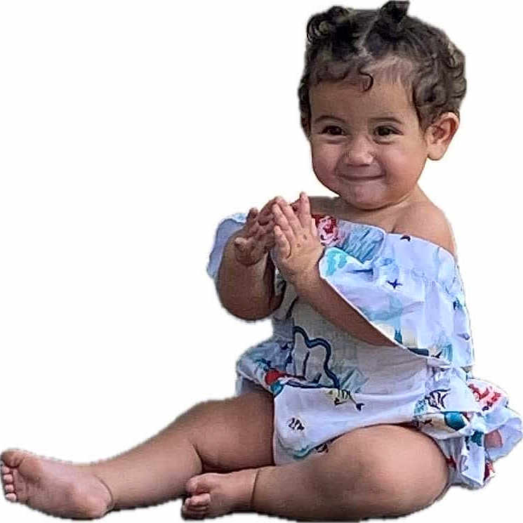 Teigen is registered to the contest to win money with this photo: ankle, baby, babylaughing, barefoot, bodypart, clothing, diaper, dress, face, finger, hand, happy, head, person, photography, portrait, shorts, sitting, sleeve, smile
