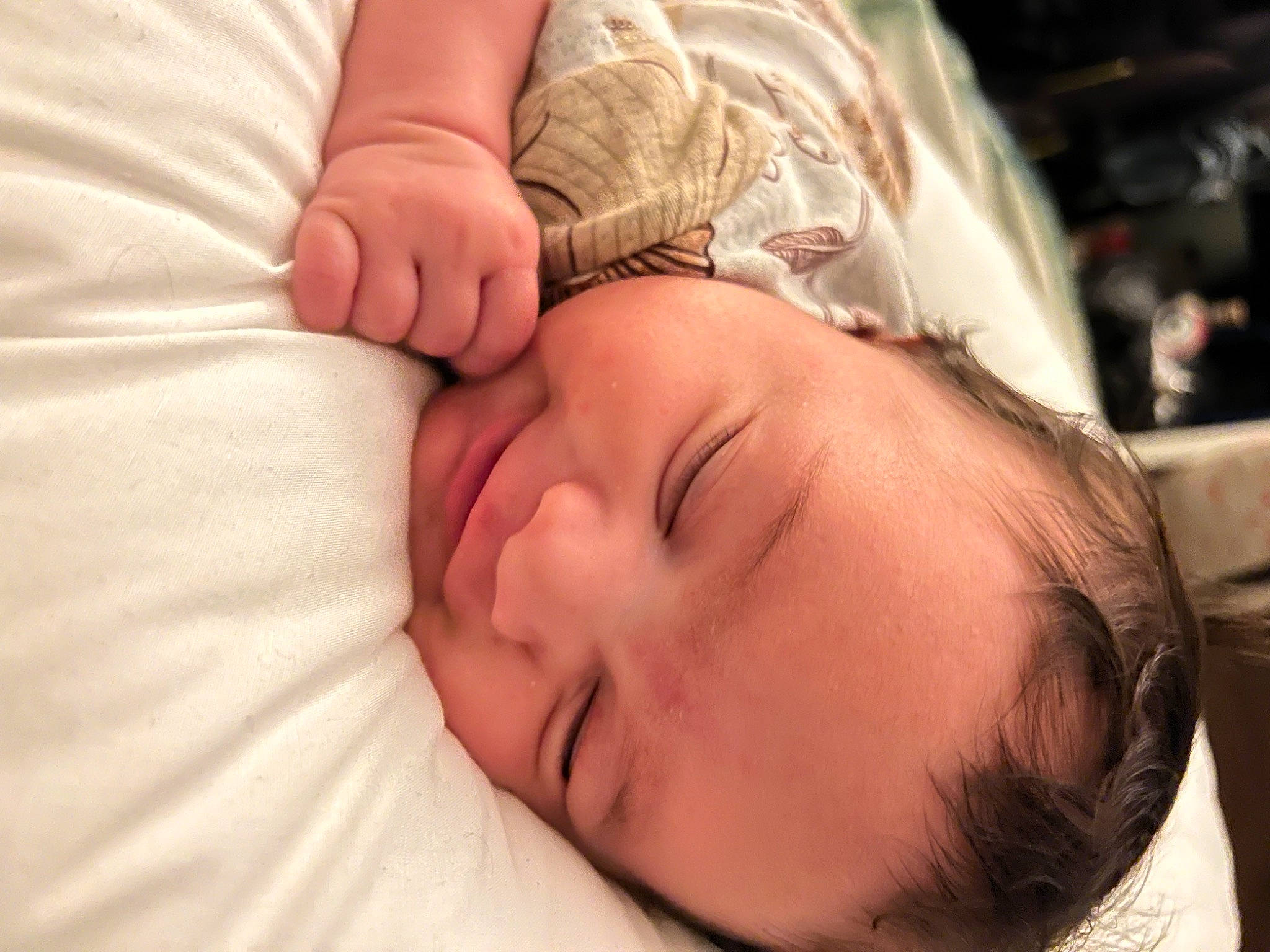 Amira is registered to the contest to win money with this photo: baby, bedtime, cheek, child, close_up, comfort, ear, eye, eyebrow, eyelash, facial_expression, finger, gesture, hand, happy, mouth, neck, nose, person, skin