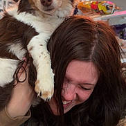 Milo is registered to the contest to win money with this photo: dog, woman, smiling, happy, indoor, playing, pet, face, hair, paw, friendship, casual, brown_hair, fur, joy, candid, human, animal, laughing, closeup