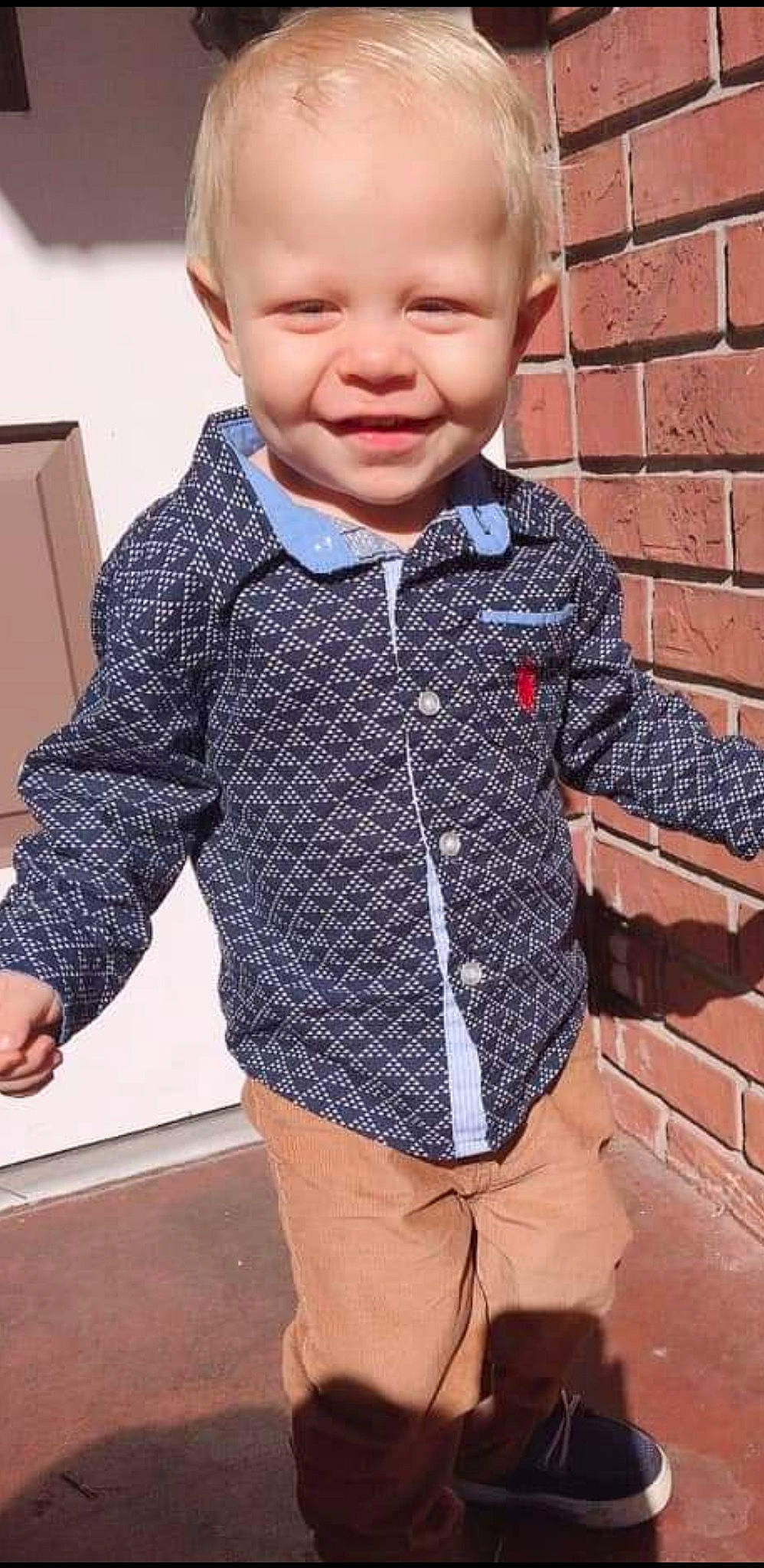 Chance is registered to the contest to win money with this photo: baby_toddler_clothing, clothing, collar, cool, denim, dress_shirt, gesture, happy, joy, neck, outerwear, pattern, person, photograph, plaid, sleeve, smile, standing, t_shirt, tartan