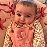 Lillith is registered to the contest to win money with this photo: baby, infant, cute, smile, face, eyes, pink_overall, bunny_pocket, floral_shirt, blanket, soft_texture, cozy, indoor, portrait, child, young, adorable, clothing, cute_expression, person