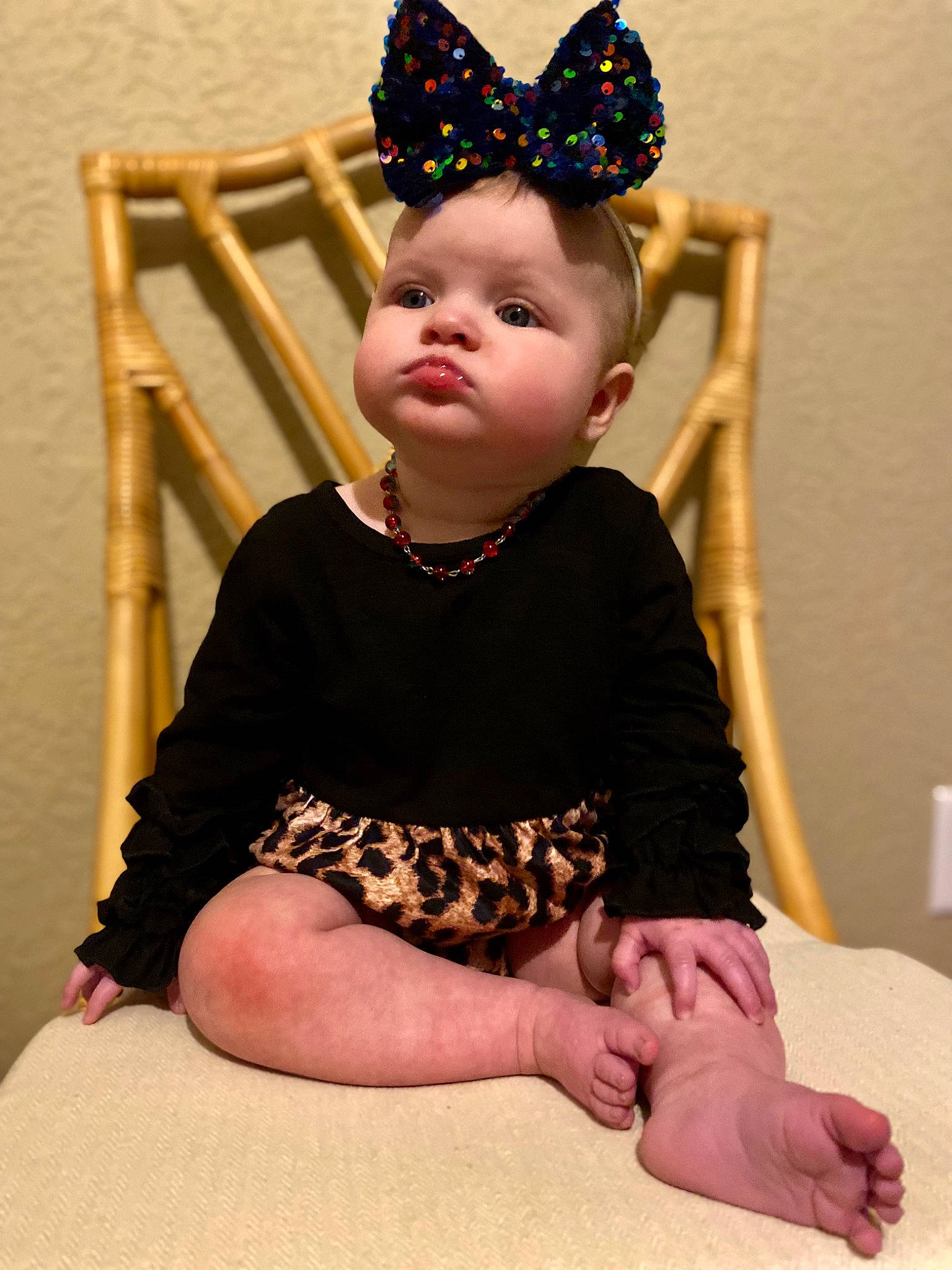 Lillian joined the competition — help win amazing prizes! baby_toddler_clothing, chair, child, comfort, costume_hat, face, foot, fun, head, headband, headpiece, human_body, human_leg, jewellery, knee, neck, party_hat, person, sleeve, thigh