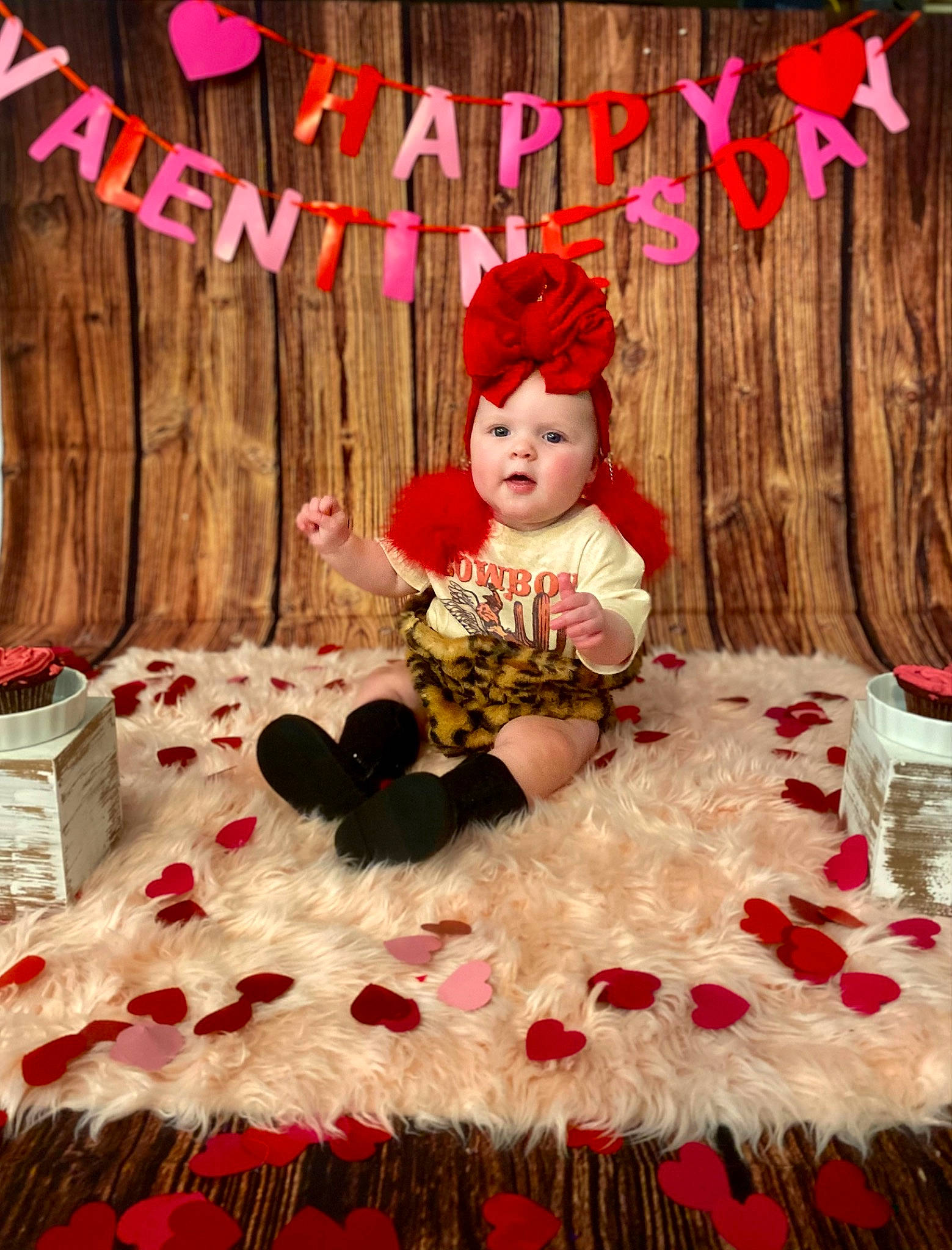 Lillian is registered to the contest to win money with this photo: baby, baby_toddler_clothing, cap, child, event, fashion, flooring, happy, headpiece, headwear, holiday, linens, magenta, pattern, person, petal, pink, red, room, sitting