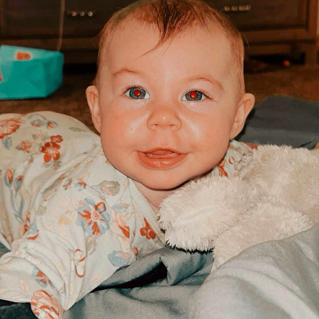 Scarlett is registered to the contest to win money with this photo: baby, bed, bedroom, blanket, cabinet, child, face, female, furniture, girl, happy, head, homedecor, indoors, newborn, person, photography, portrait, room, smile