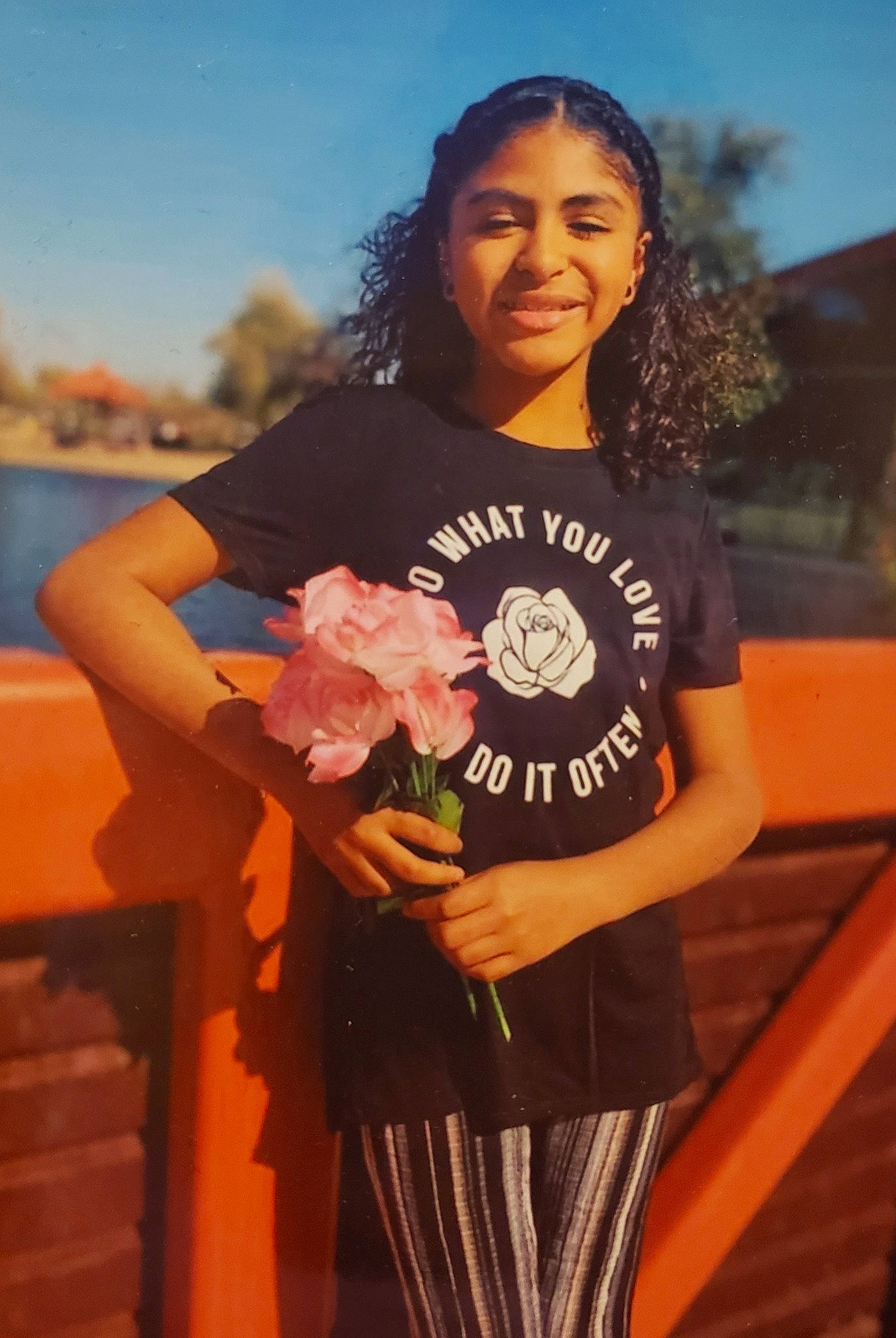 Alexus is registered to the contest to win money with this photo: abdomen, brown_hair, electric_blue, flash_photography, floral_design, flower, fun, happy, joy, landscape, long_hair, orange, people_in_nature, person, plant, sky, sleeve, smile, street_fashion, t_shirt