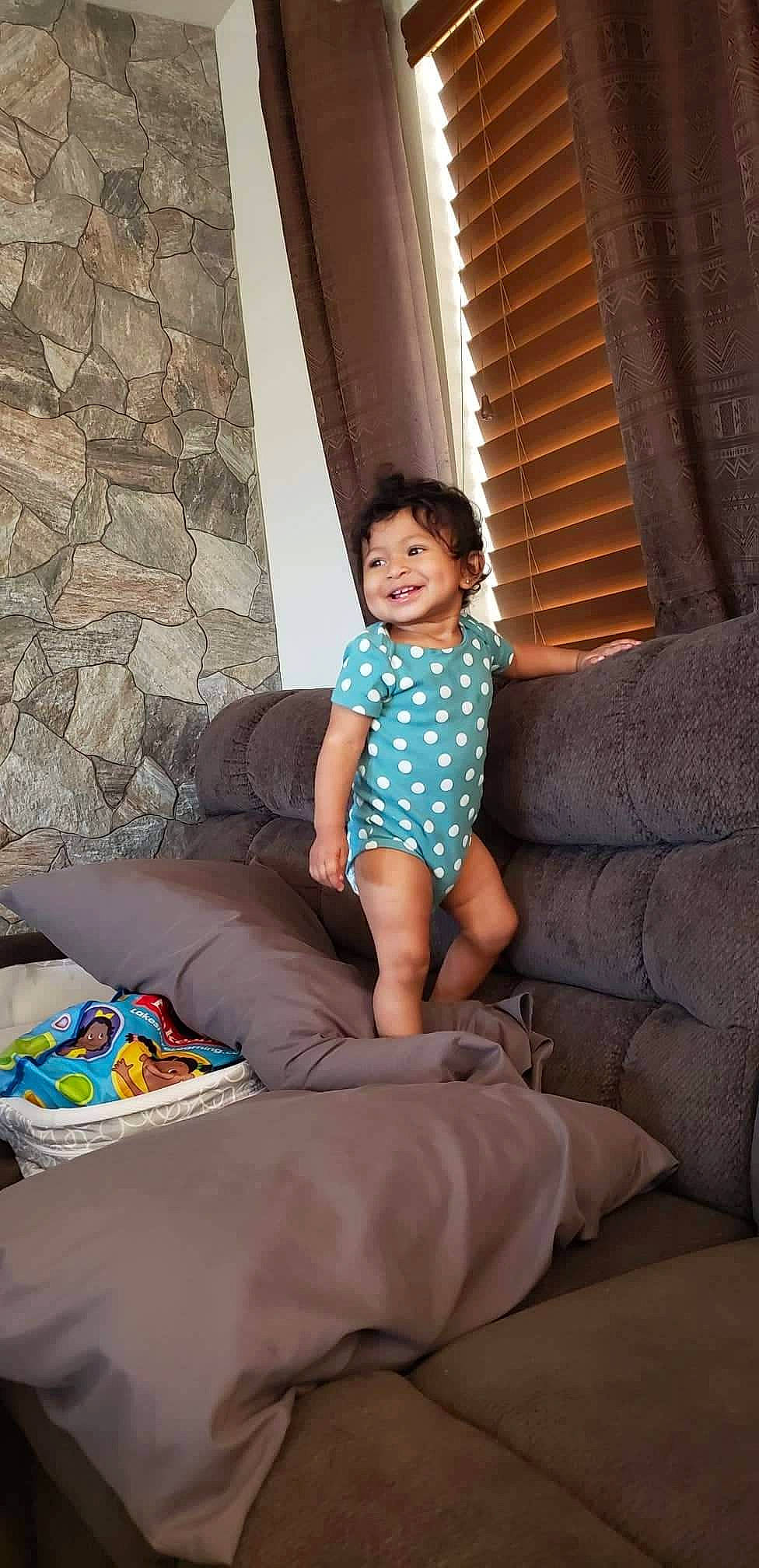 Kiarah joined the competition — help win amazing prizes! azure, barefoot, comfort, couch, electric_blue, eye, flooring, foot, fun, happy, human_leg, joy, knee, leisure, living_room, person, sitting, smile, sock, textile