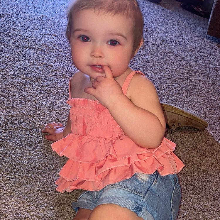 Brynlee joined the competition — help win amazing prizes! baby, clothing, couch, cutlery, dress, face, food, footwear, furniture, head, jeans, pants, person, photography, portrait, shoe, shorts, sitting, spoon, sweets