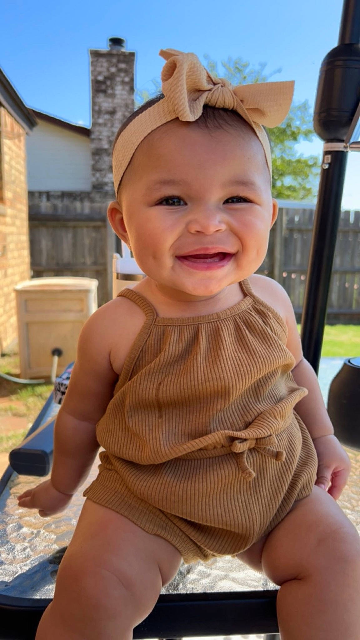 Saylor is registered to the contest to win money with this photo: baby, blond, cheek, child, eye, finger, fun, grass, happy, human_body, joy, leisure, mouth, person, pink, skin, sky, smile, thigh, thumb