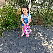 Jmilah joined the competition — help win amazing prizes! child, girl, pigtails, standing, sidewalk, bag, pink, minnie_mouse, flowers, greenery, plants, sunlight, shadows, outdoor, casual_clothing, denim_overalls, white_tshirt, sandals, cute, smiling