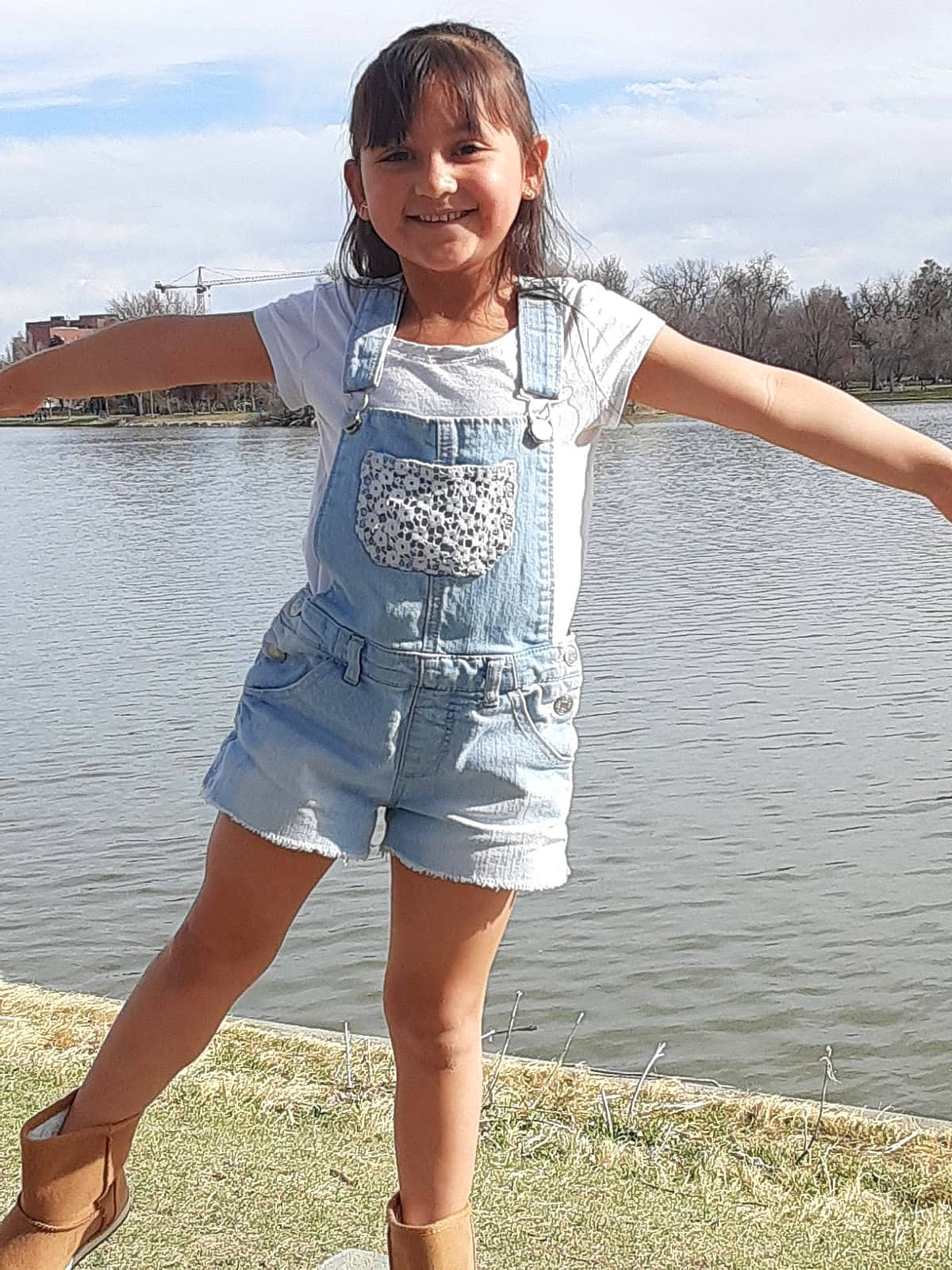 Zoey is registered to the contest to win money with this photo: blue, child, clothing, denim, dress, fashion, jeans, joy, leg, person, photography, sea, shorts, sleeve, summer, t_shirt, textile, thigh, vacation, waist