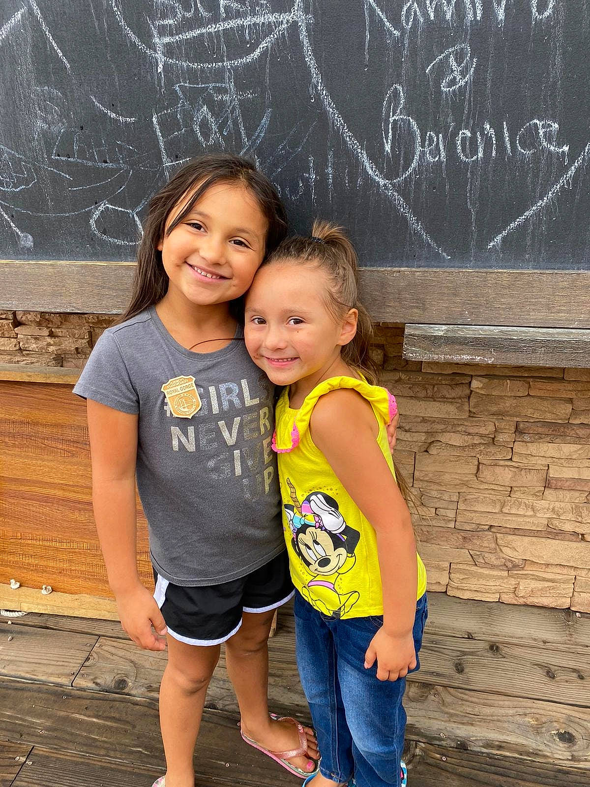 Zoey joined the competition — help win amazing prizes! blackboard, child, family, fun, happy, joy, people, person, photography, sibling, smile, t_shirt, toddler, vacation, wall, yellow