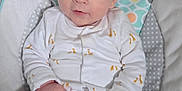 Louie is registered to the contest to win money with this photo: baby, baby_cushion, blue_eyes, child, comfort, cozy, cute, face, giraffe_pattern, hands, indoors, infant, onesie, patterned, pink_skin, portrait, seated, soft_toys, white_clothing, young_child