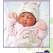 Athena is registered to the contest to win money with this photo: baby, newborn, sleeping, pink, mittens, hat, bunny_ears, blanket, cute, infant, clothing, cartoon, soft, face, peaceful, portrait, young_child, adorable, resting, child