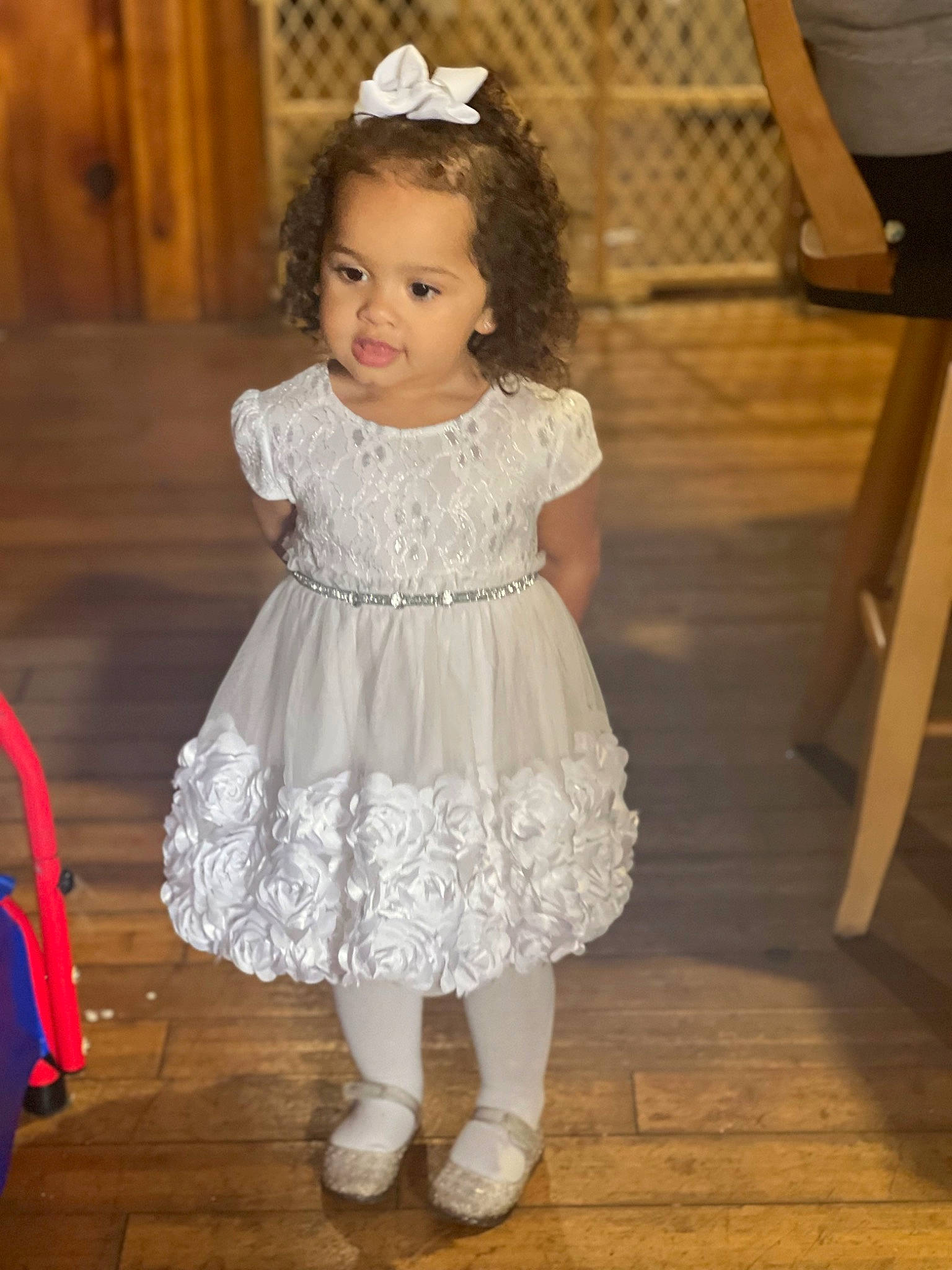 Viviana is registered to the contest to win money with this photo: baby_toddler_clothing, child, clothing, day_dress, dress, embellishment, face, facial_expression, fashion_design, floor, flooring, happy, iris, person, pink, skin, sleeve, standing, toddler, waist