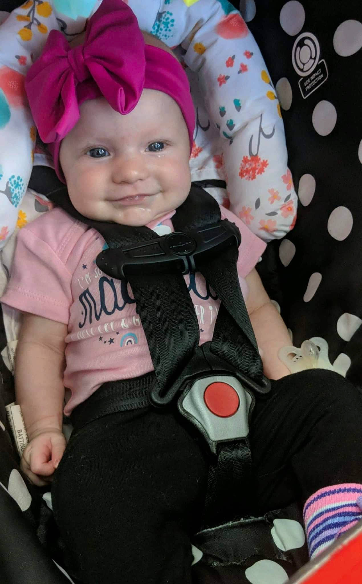 Evelynn joined the competition — help win amazing prizes! baby, baby_carriage, baby_products, baby_safety, baby_toddler_clothing, cap, cheek, child, face, fashion_accessory, fun, happy, headwear, joy, magenta, person, personal_protective_equipment, pink, sitting, skin