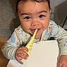 toddler, child, toy, giraffe, pajamas, table, face, smile, indoor, carpet, doorframe, hand, curious, bright_eyes, playing, baby, cute, young_child, person, home