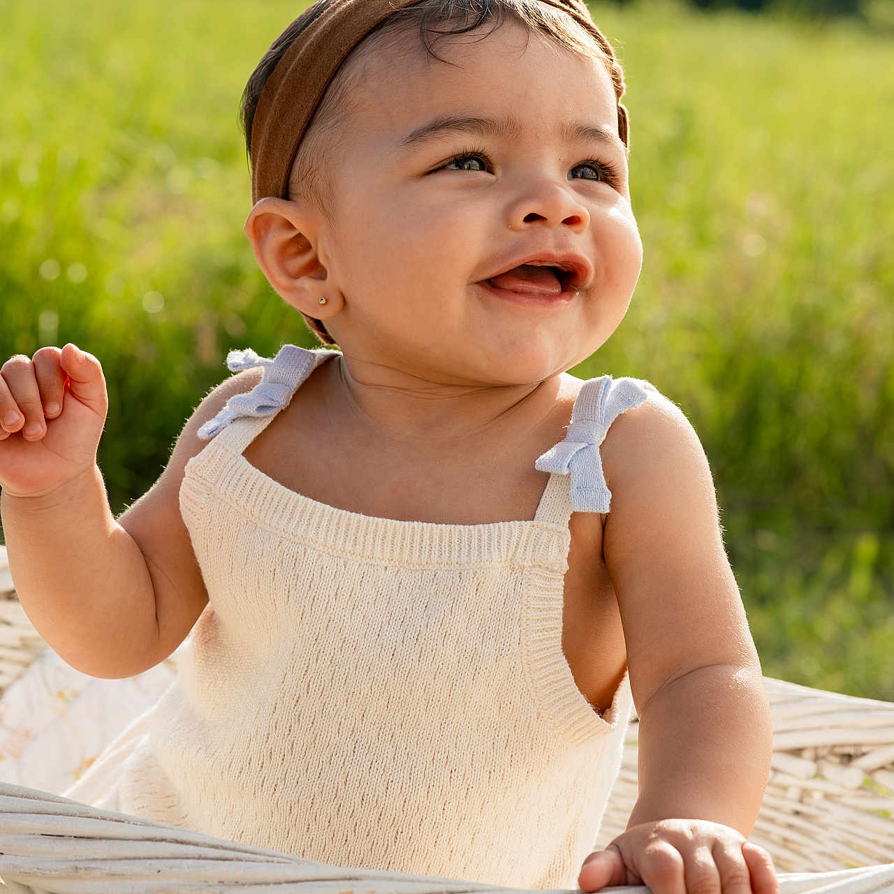Kya joined the competition — help win amazing prizes! toddler, child, smiling, headband, knitwear, basket, outdoor, greenery, sunlight, portrait, happy, cute, baby, nature, grass, summer, skin, person, daylight, playful