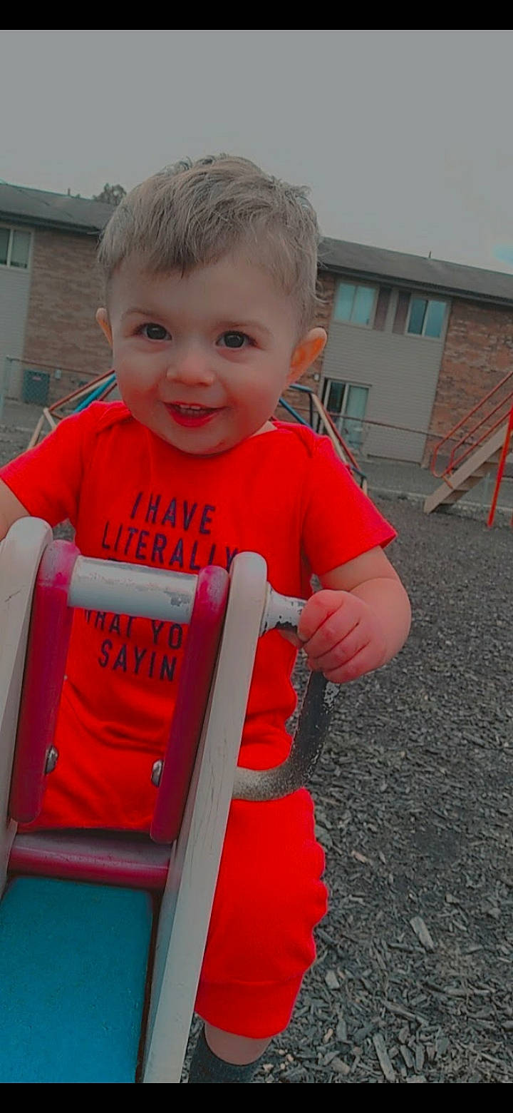 Jordan joined the competition — help win amazing prizes! baby, baby_products, baby_toddler_clothing, child, city, electric_blue, fun, grass, happy, joy, leisure, magenta, person, play, recreation, sitting, sleeve, smile, t_shirt, toddler