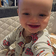 Kyro joined the competition — help win amazing prizes! baby, blur, child, closeup, clothing, cute, face, hand, happy, head, home, indoor, infant, pajamas, person, playpen, quilted_background, smiling, toy, young_child