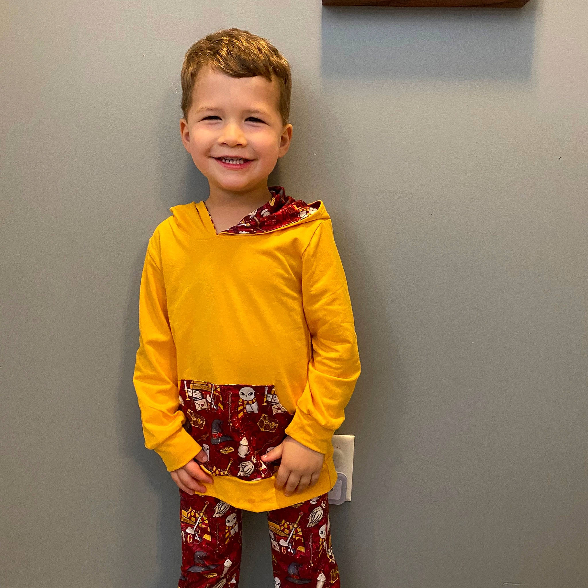 Patryk is registered to the contest to win money with this photo: baby_toddler_clothing, blazer, child, collar, dress, dress_shirt, fashion_design, happy, joint, joy, neck, orange, outerwear, person, shoulder, sleeve, smile, sportswear, street_fashion, t_shirt
