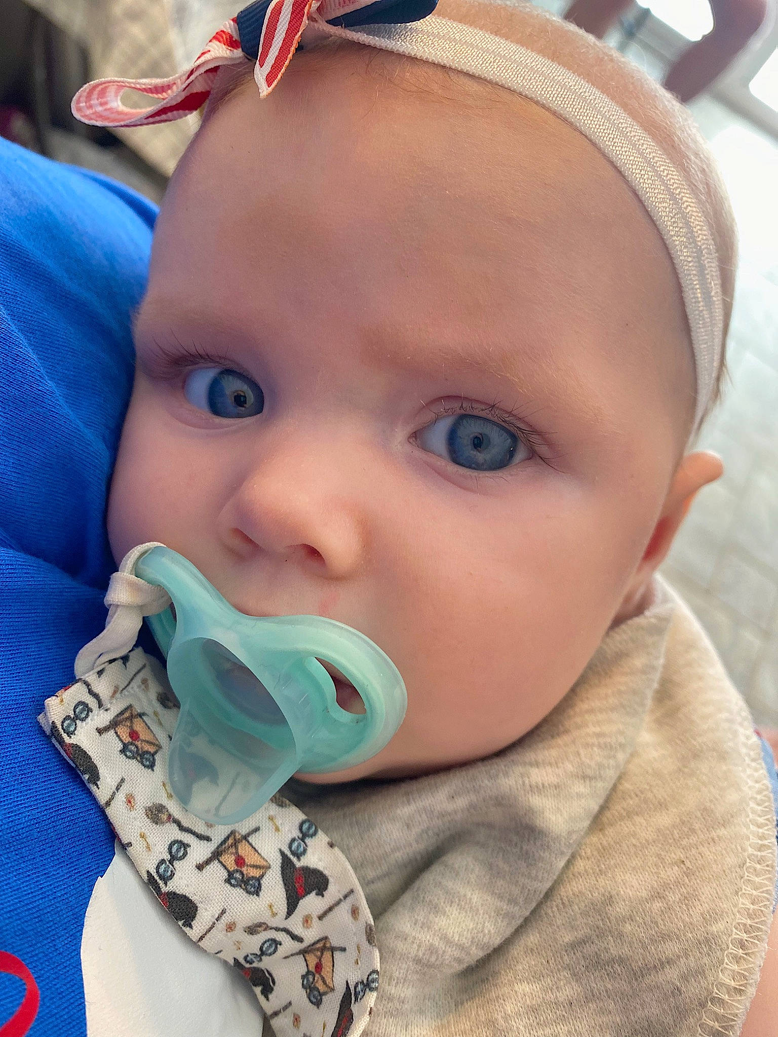 Arya joined the competition — help win amazing prizes! baby, baby_toddler_clothing, blue, cap, cheek, close_up, cool, ear, eyebrow, eyelash, fun, grass, happy, iris, lip, mouth, nose, outerwear, person, skin