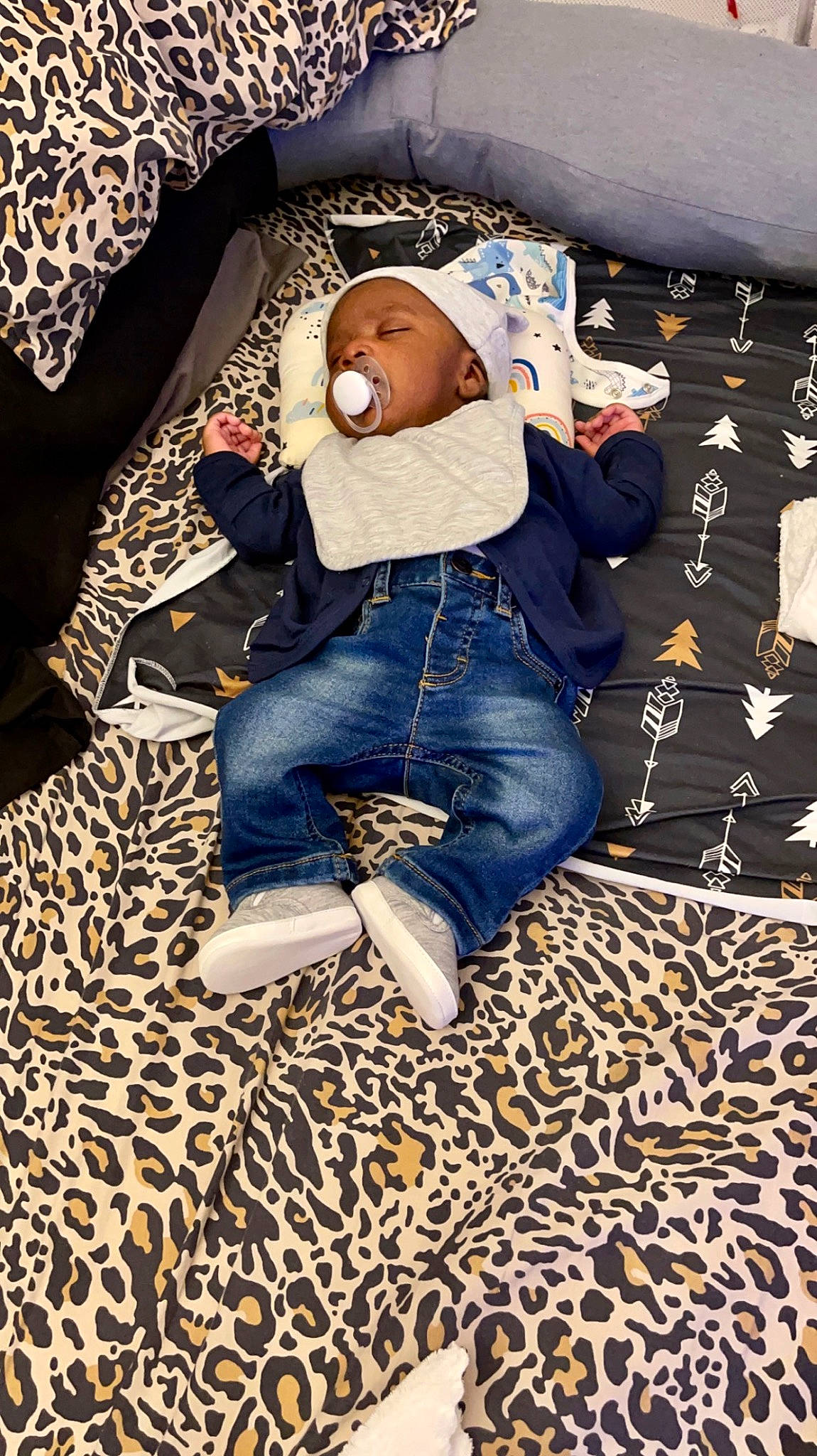 Kai joined the competition — help win amazing prizes! baby, bedding, child, comfort, couch, denim, flooring, fun, fur, human_leg, jeans, linens, nap, pattern, person, sitting, sleep, t_shirt, textile, toddler