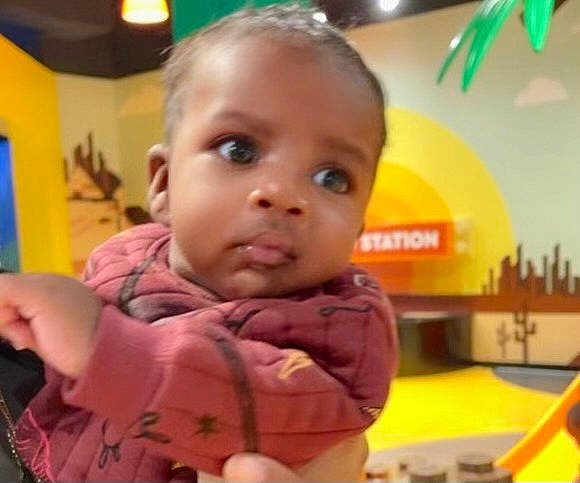 Kai is registered to the contest to win money with this photo: baby, baby_toddler_clothing, cheek, child, ear, eye, eyelash, finger, forehead, fun, gesture, happy, head, iris, nose, person, play, room, sleeve, thumb