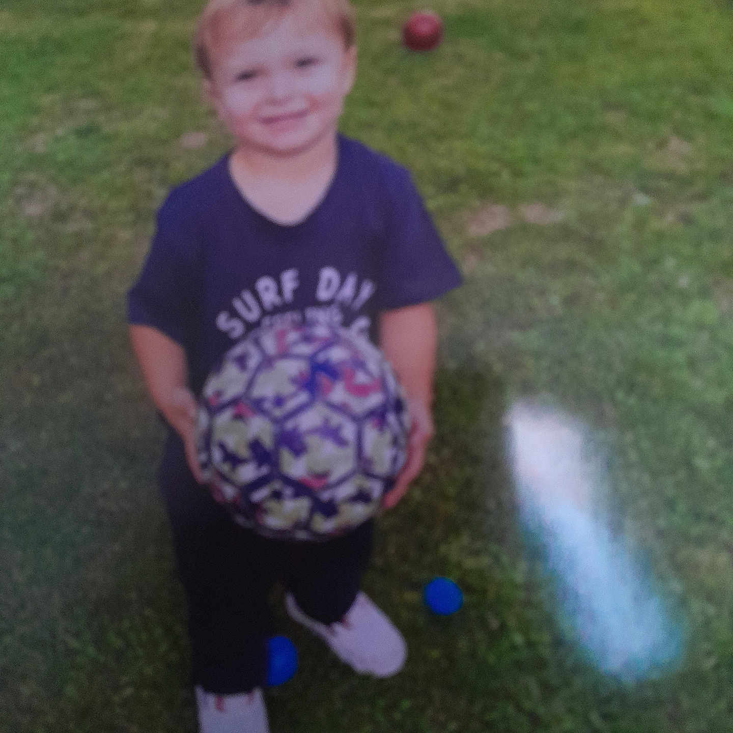 John Andre participe au concours pour gagner de l'argent avec cette photo : backyard, ball, boy, child, clothing, face, football, grass, head, male, nature, person, photography, plant, portrait, soccer, soccerball, sphere, sport, t_shirt