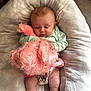 baby, sleeping, stuffed_animal, pink, fluffy, pillow, diaper, infant, cozy, child, cute, resting, soft, clothing, indoors, person, young, toddler, comfort, peaceful