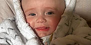 Mabel is registered to the contest to win money with this photo: baby, blanket, child, clothing, comfort, cozy, cushion, cute, face, fluffy, hand, happy, indoors, infant, portrait, robe, skin, smiling, star_pattern, young