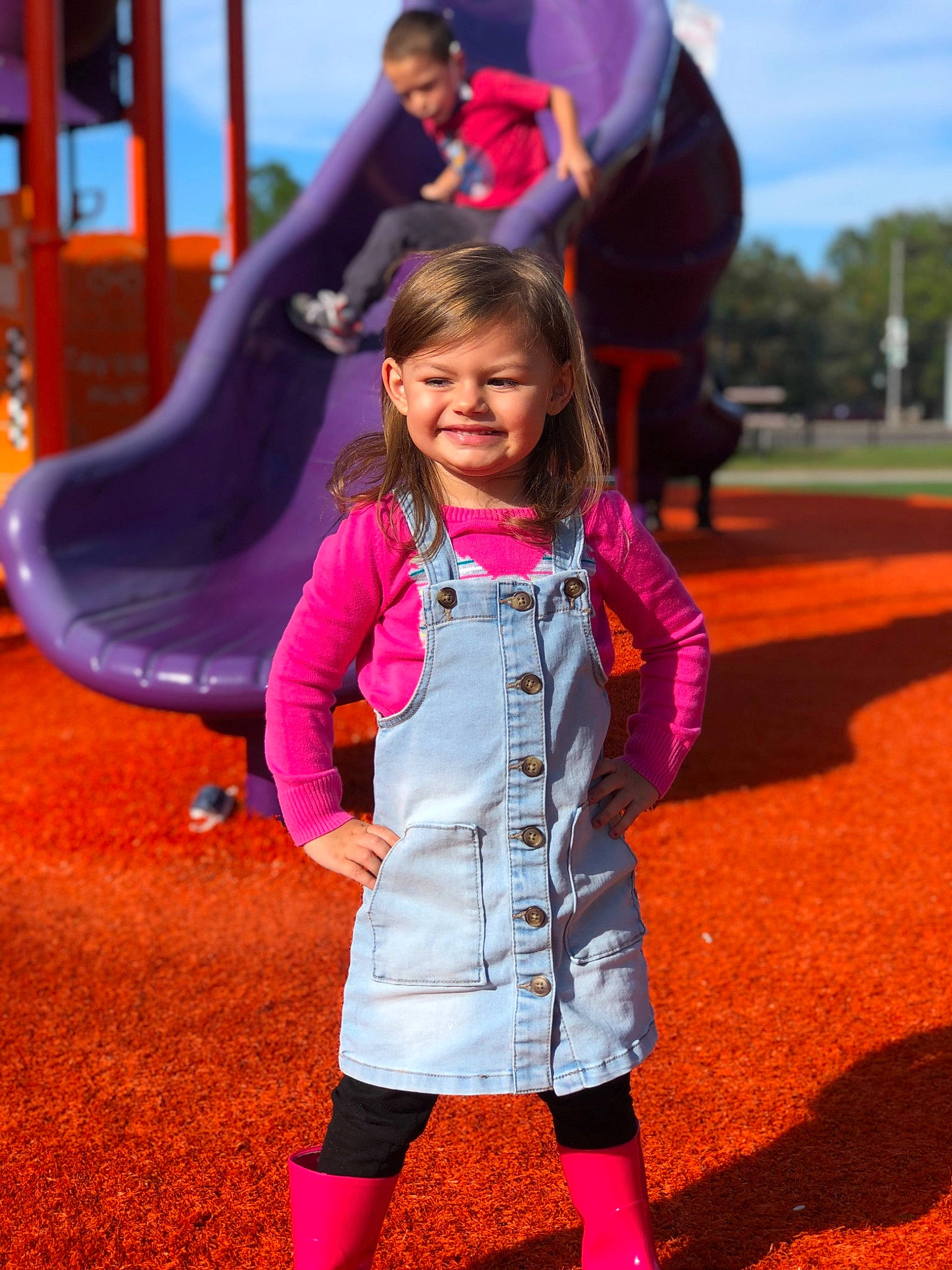 Calie is registered to the contest to win money with this photo: blurred, facial_expression, fun, grass, hairstyle, happy, joy, leisure, mammal, nature, person, photograph, pink, public_space, purple, red, shoe, smile, toddler, tree