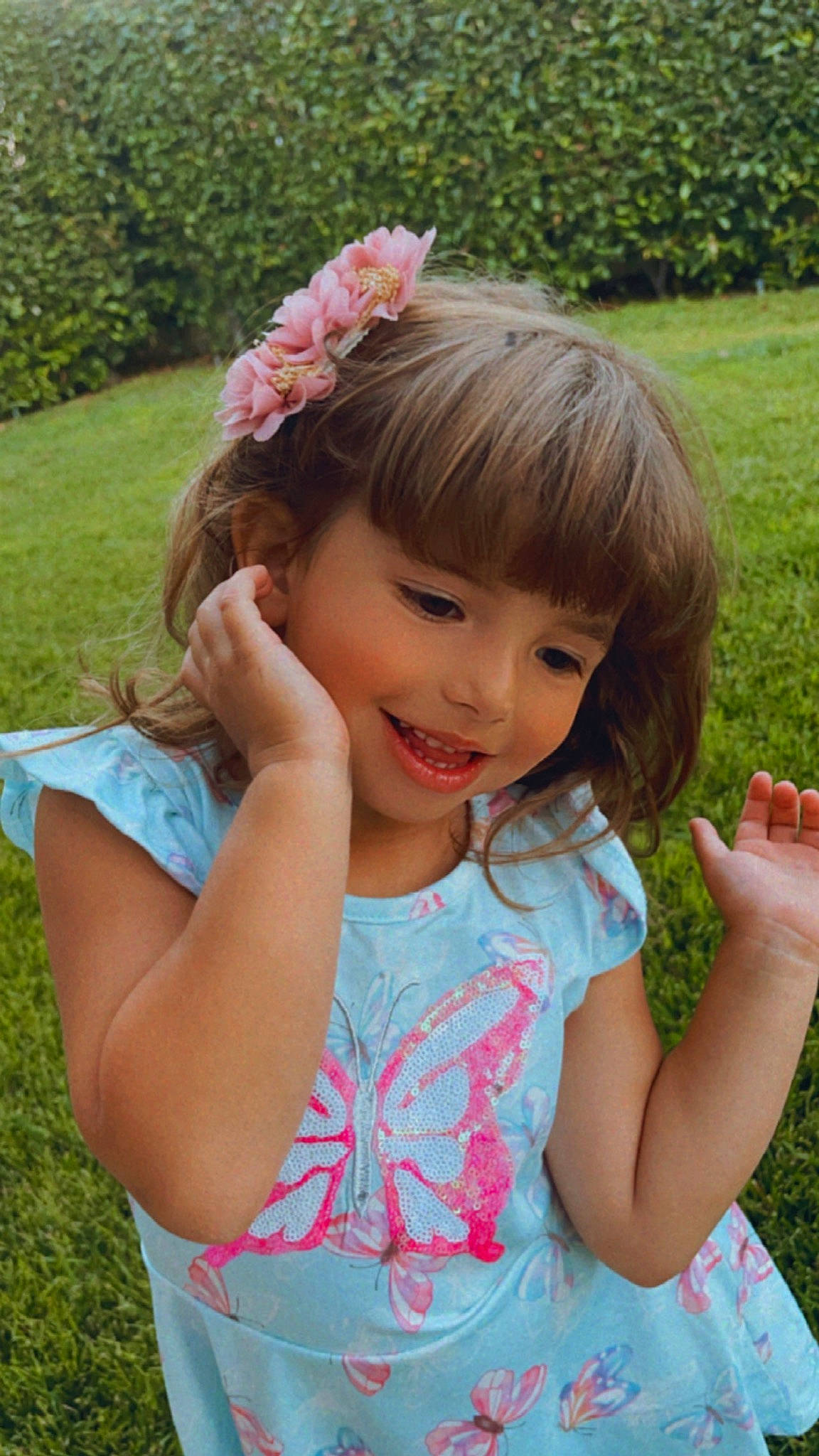 Naya joined the competition — help win amazing prizes! arm, baby_toddler_clothing, clothing, facial_expression, finger, gesture, grass, hairstyle, hand, happy, iris, joy, leaf, nature, people_in_nature, person, pink, plant, smile, sunlight