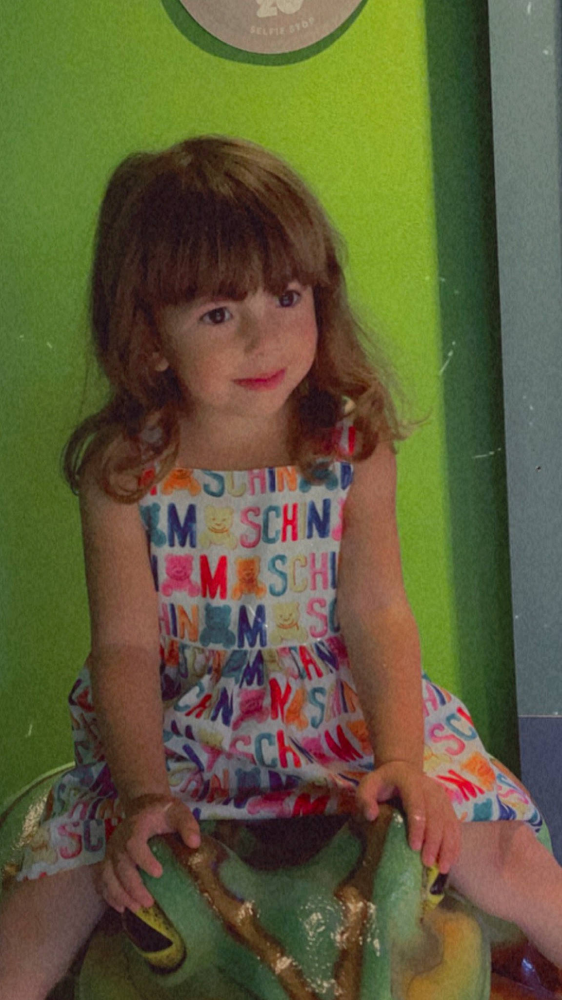 Naya is registered to the contest to win money with this photo: arm, baby_toddler_clothing, bangs, cheek, child, chin, dress, eyelash, face, hair, happy, human_body, iris, person, pink, shoulder, skin, sleeve, t_shirt, thigh