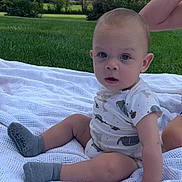 Braydon joined the competition — help win amazing prizes! baby, child, outdoor, grass, blanket, onesie, socks, person, infant, nature, greenery, sky, clouds, summer, cute, portrait, sitting, young, casual, daylight