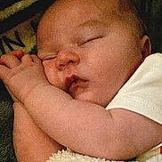 Liam joined the competition — help win amazing prizes! arm, baby, bedding, blanket, chubby_cheeks, closed_eyes, closeup, cozy, face, hand, indoors, infant, newborn, onesie, peaceful, portrait, resting, skin, sleeping, soft_texture