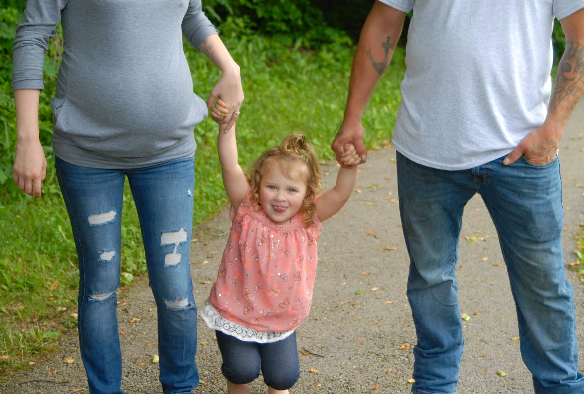 Aleah is registered to the contest to win money with this photo: clothing, community, facial_expression, fun, gesture, grass, hand, happy, human_body, joint, joy, leaf, leg, leisure, natural_environment, people_in_nature, person, plant, social_group, standing