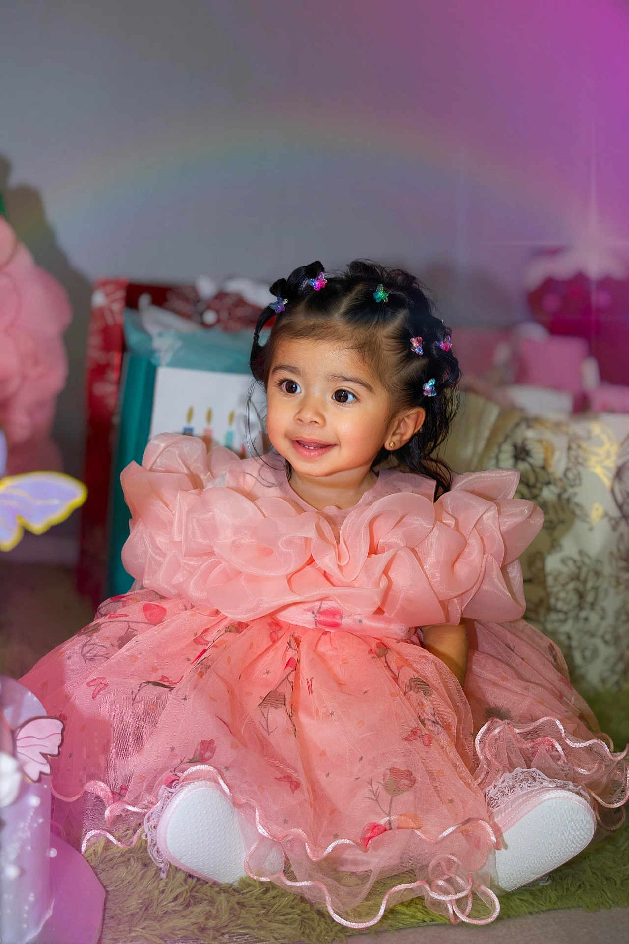 Nelsy Lucia joined the competition — help win amazing prizes! child, girl, birthday, dress, pink, smile, hair_clips, butterfly_clips, gift, carpet, indoor, celebration, happy, cute, sitting, decorations, party, young_child, portrait, person