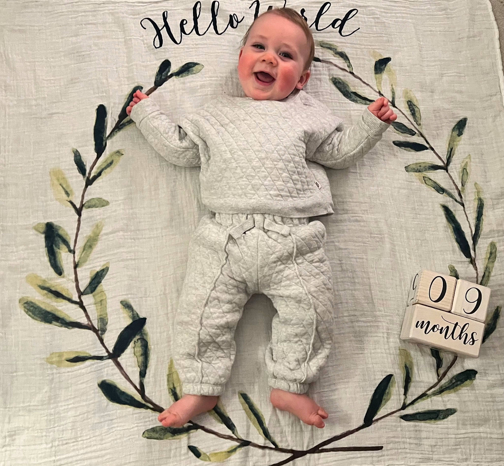 Callen joined the competition — help win amazing prizes! baby, baby_toddler_clothing, child, face, font, happy, head, illustration, linens, pattern, person, photo_caption, picture_frame, portrait_photography, rectangle, sleeve, smile, toddler, twig, white