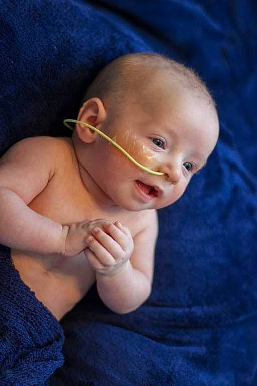 Ezio joined the competition — help win amazing prizes! arm, baby, baby_toddler_clothing, blue, comfort, eye, eyebrow, face, finger, flash_photography, gesture, glasses, hair, hand, happy, iris, lip, nose, person, smile