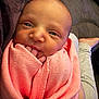 Aria is registered to the contest to win money with this photo: baby, newborn, infant, pink_blanket, swaddled, fingers, face, person, skin, resting, lap, comfort, curious, closeup, indoors, cozy, soft, couch, clothing, human