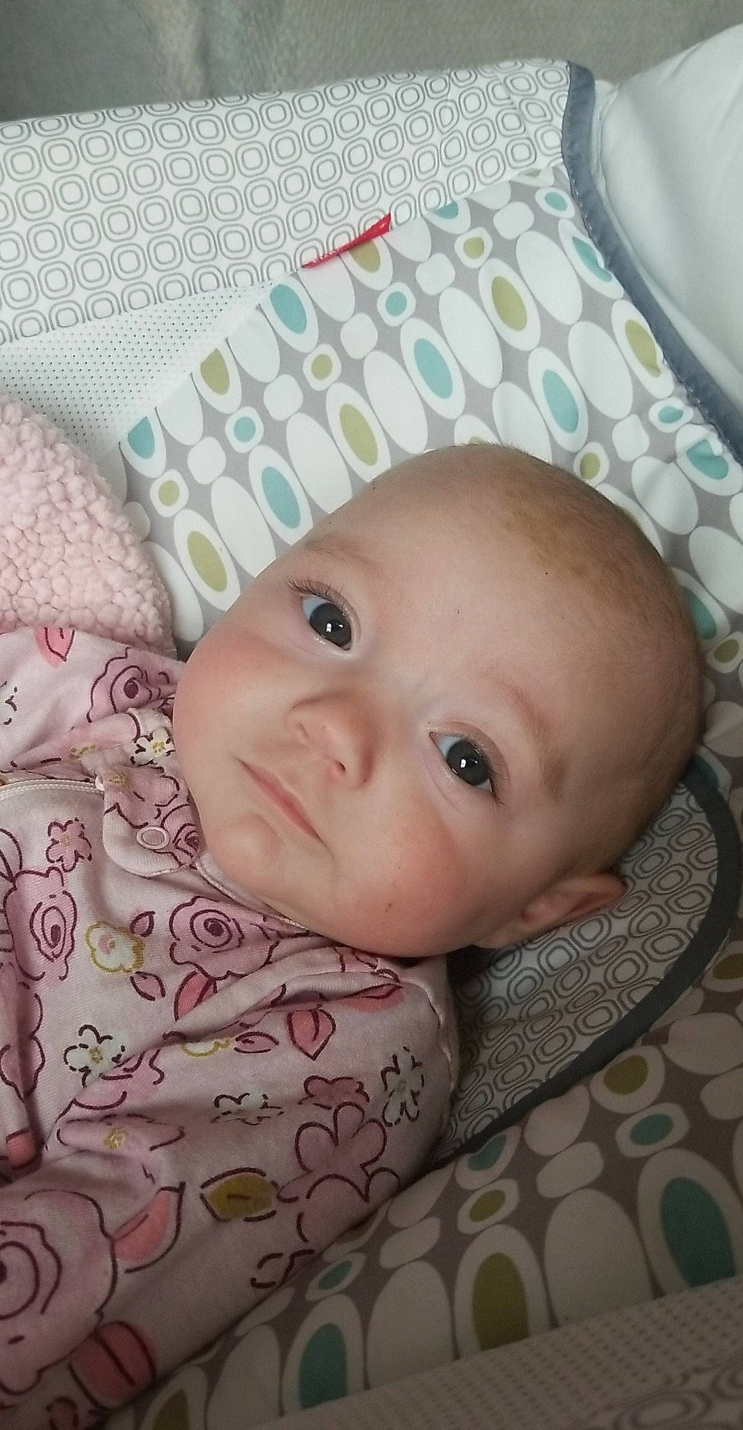 Stella is registered to the contest to win money with this photo: baby, baby_products, baby_toddler_clothing, cheek, child, circle, comfort, eyelash, happy, iris, linens, pattern, person, portrait_photography, skin, smile, toddler