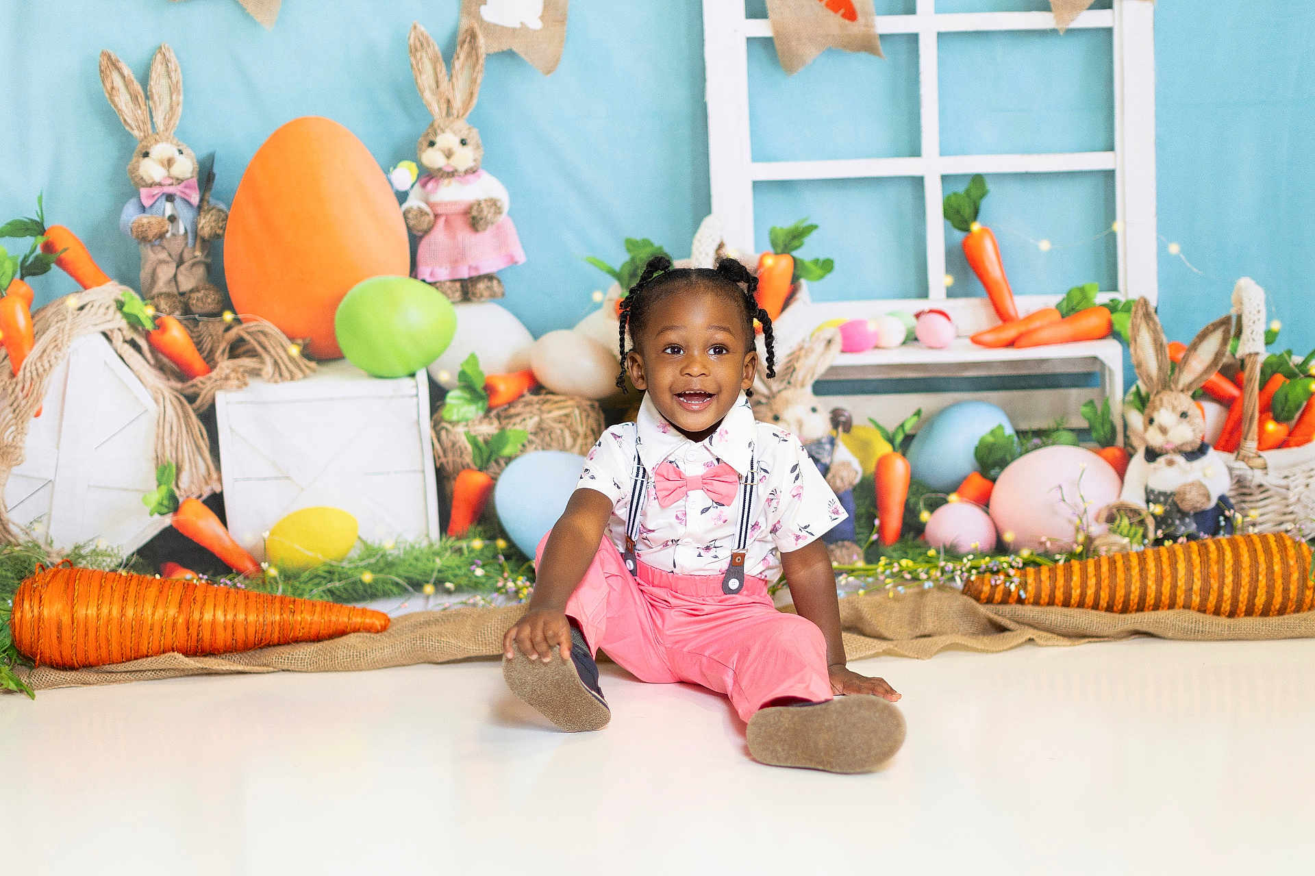 Braxton is registered to the contest to win money with this photo: child, toddler, smiling, easter, carrot, egg, bunny, decorations, colorful, playful, holiday, indoors, floor, sitting, clothing, bowtie, happy, portrait, festive, background
