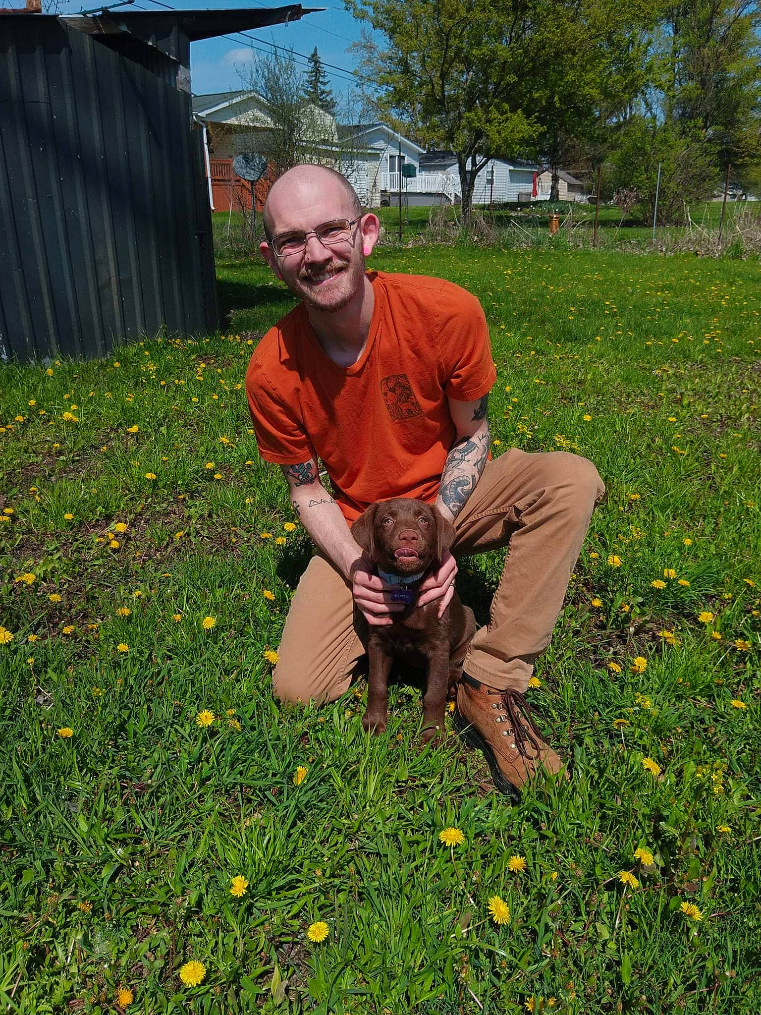 Saffron is registered to the contest to win money with this photo: agriculture, farmworker, field, flower, flowering_plant, glasses, grass, grassland, groundcover, happy, landscape, lawn, meadow, people_in_nature, plant, prairie, shrub, sky, smile, tree