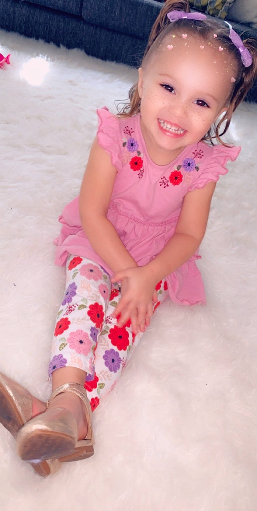 Hermione is registered to the contest to win money with this photo: baby, baby_toddler_clothing, beauty, cheek, child, child_model, dress, finger, human_leg, joy, knee, leg, leggings, pattern, person, pink, sitting, skin, sleeve, smile