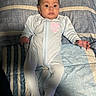 Elena joined the competition — help win amazing prizes! baby, infant, onesie, bed, striped_bedspread, blue, pink, heart_logo, lying_down, wide_eyes, curious, clothing, hands, footed_pajamas, indoor, portrait, person, cute, child, sleepwear