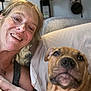 Bodhi is registered to the contest to win money with this photo: woman, dog, smiling, selfie, indoors, couch, pet, face, happy, relaxed, fan, blanket, tank_top, light, home, furniture, portrait, closeup, nose, paw