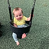 baby, barefoot, chains, child, daylight, gray_pants, happy, infant, outdoor, park, play_surface, playground, playground_equipment, portrait, sitting, smiling, swing, swing_set, toddler, yellow_shirt
