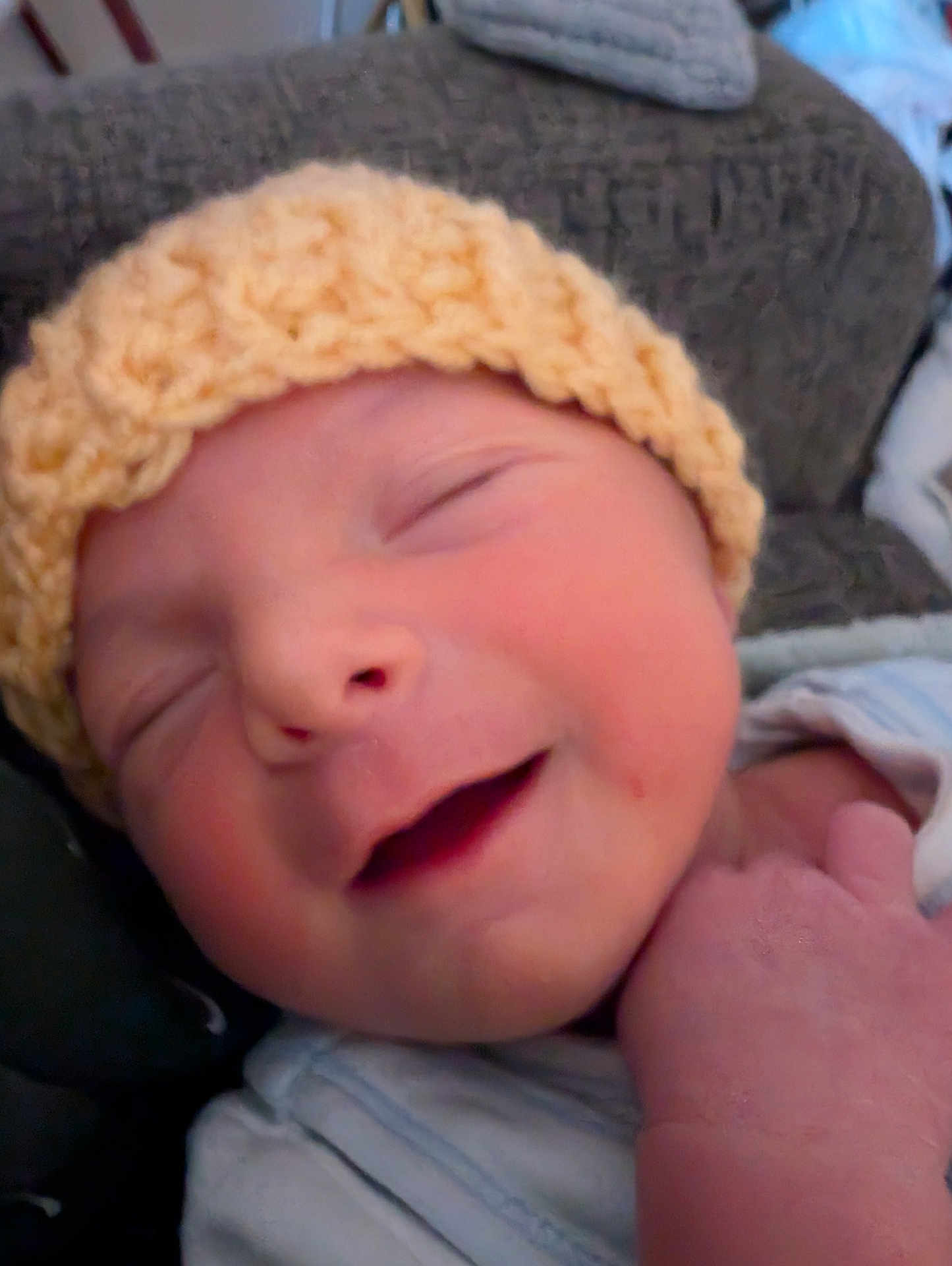 Devon joined the competition — help win amazing prizes! baby, newborn, smile, hat, knitted, face, sleeping, infant, closeup, hand, cozy, cute, skin, apparel, child, peaceful, portrait, indoors, soft, headwear