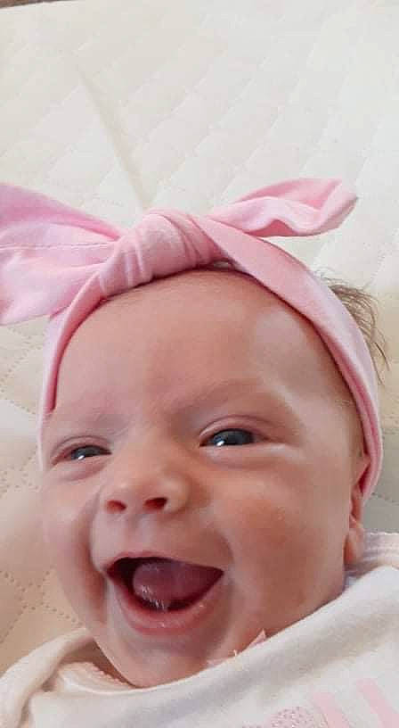 Ensley joined the competition — help win amazing prizes! baby, baby_making_funny_faces, cheek, child, chin, close_up, face, facial_expression, fashion_accessory, forehead, happy, head, headgear, headwear, lip, mouth, nose, person, pink, skin